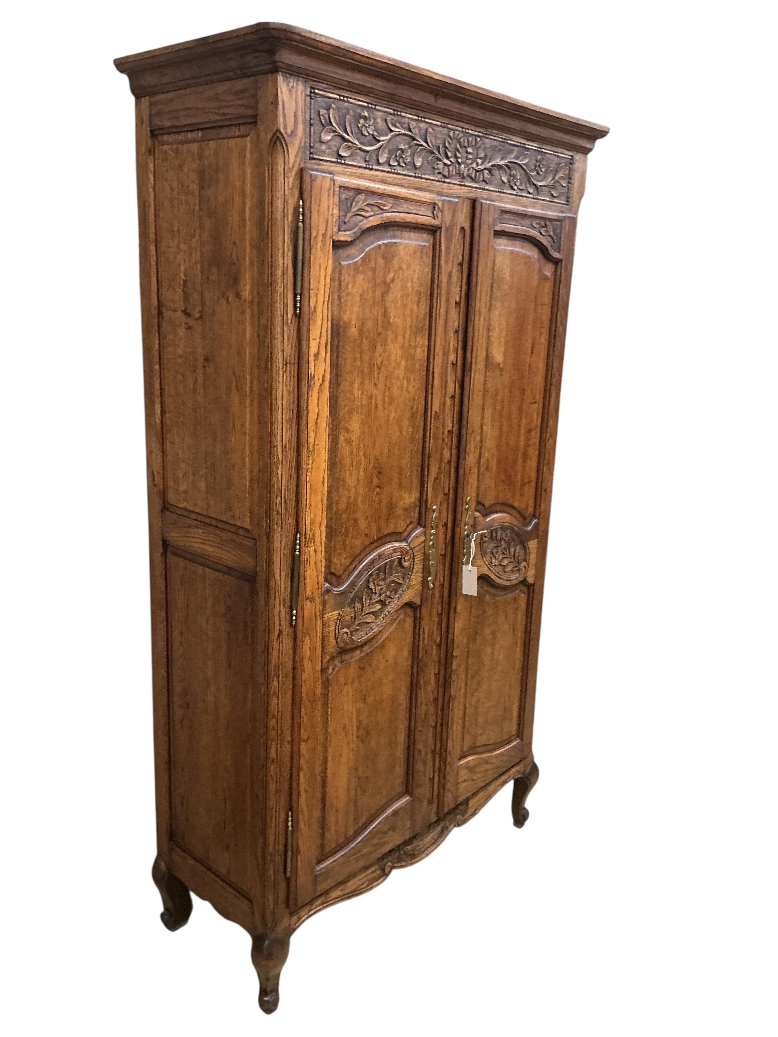 A small 18th century style French oak armoire, width 108cm, depth 45cm, height 189cm